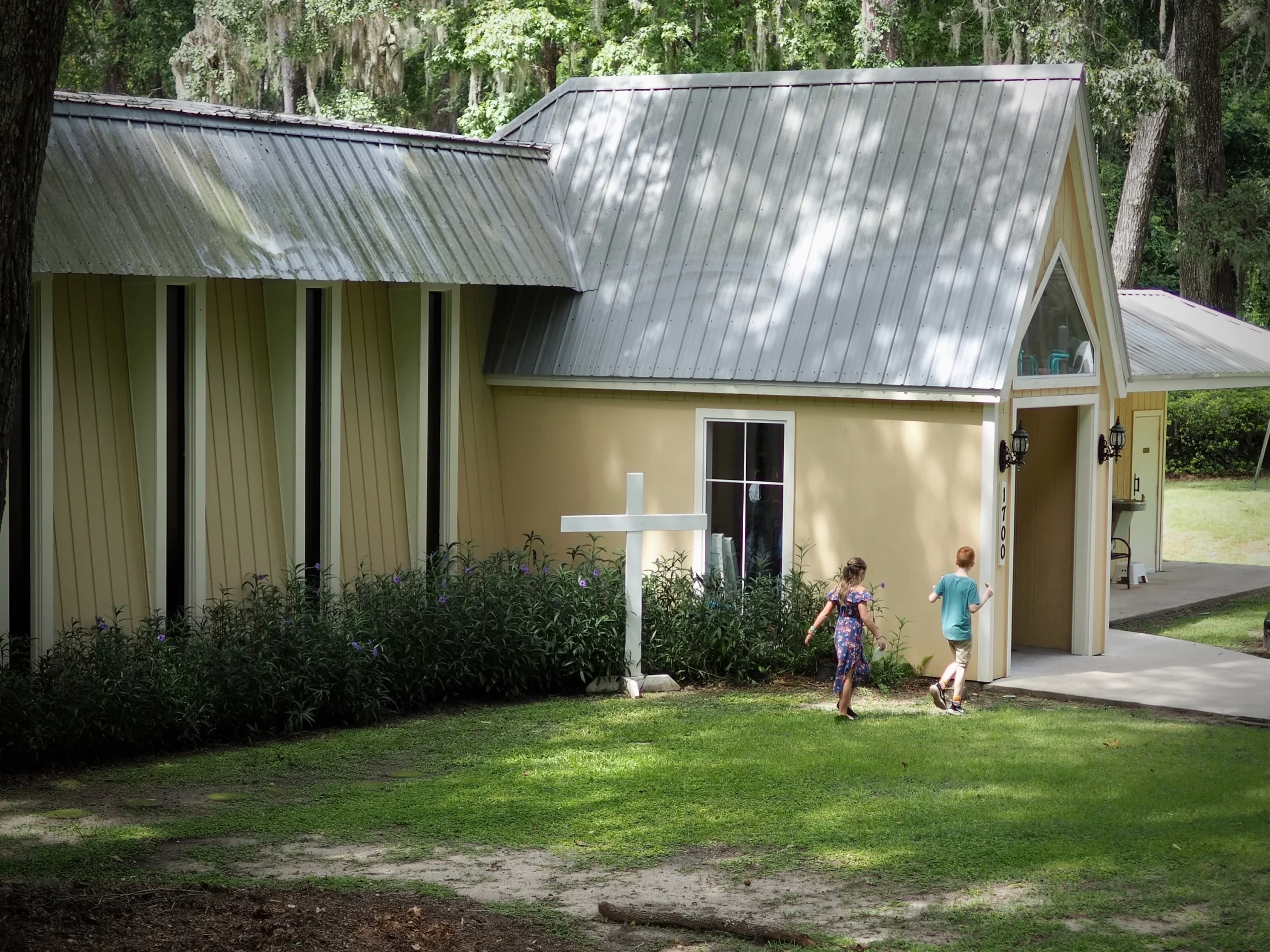 Children walking toward the entrance of a church building