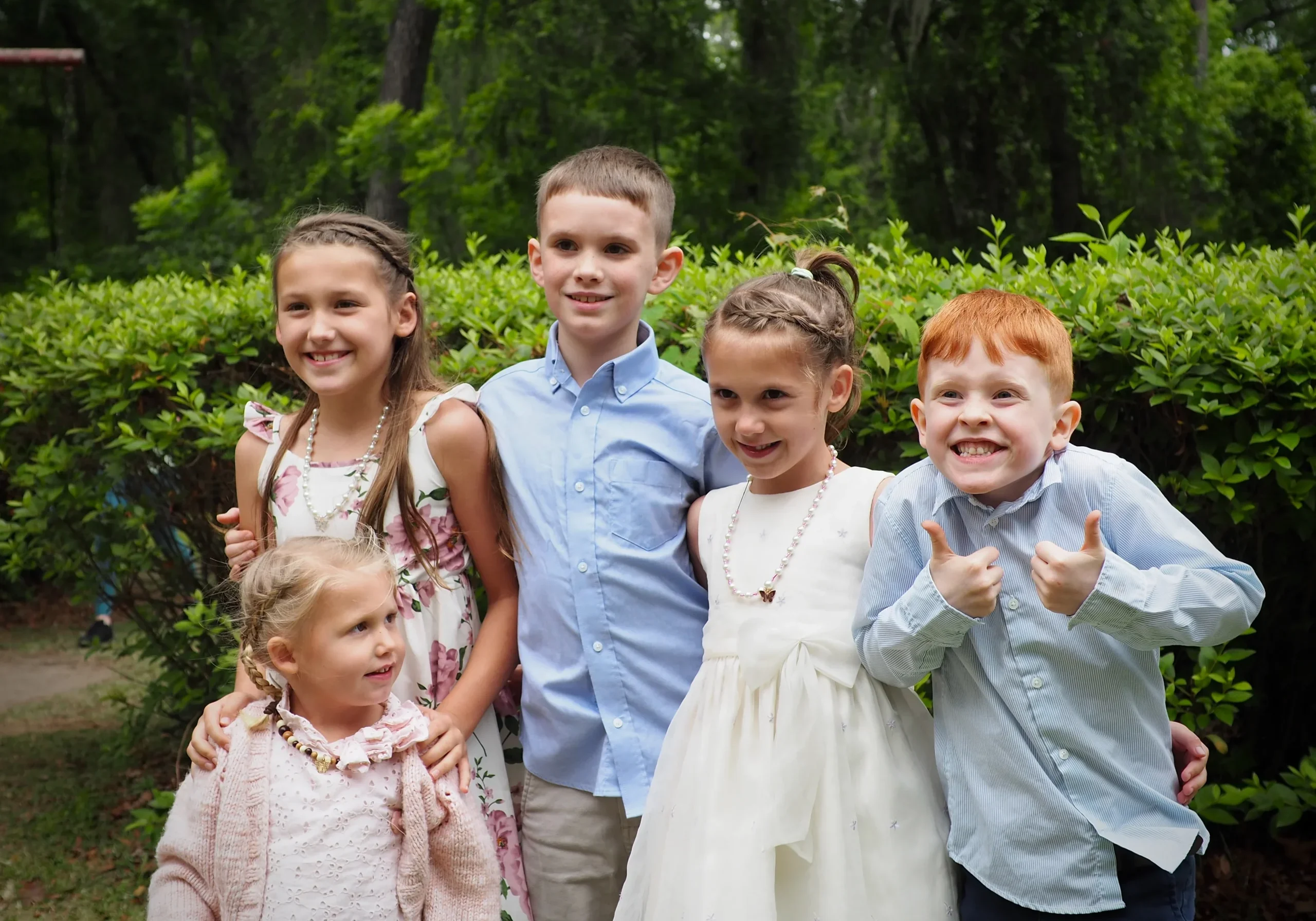 Group of children posing together outdoors at church